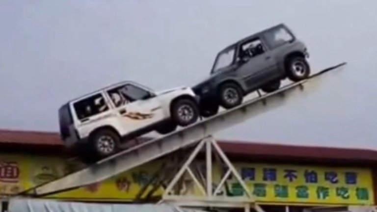 Watching Two Geo Trackers Balance on a Giant Seesaw Is Utterly Terrifying